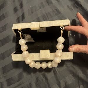 I am selling this opal little dinner satchel